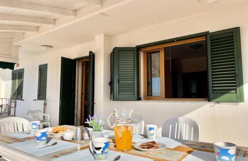 Posto Vecchio Apartment | The Front Beach Penthouse 20 m by Salento Prime