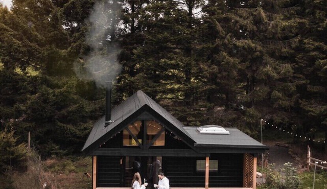 Cabin, with deck and outside bath in woodlands