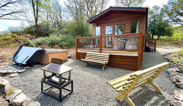 Modern and contemporary lodge style holiday home set in woodland area.